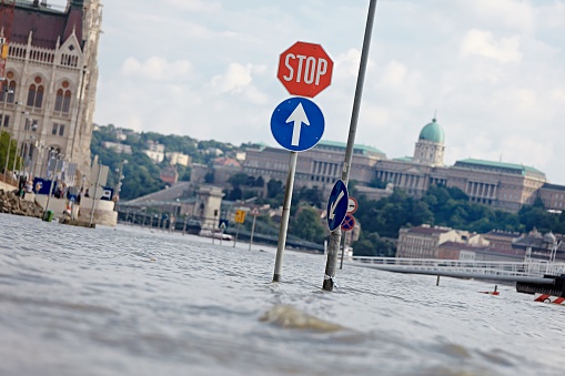 Flooded street n Budapest with traffic sign