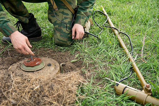 Neutralization of anti-personnel mines soldier Neutralization of anti-personnel mines soldier. land mine stock pictures, royalty-free photos & images
