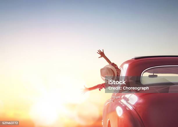 Girl Rides Into The Sunset Stock Photo - Download Image Now - Car, Summer, Road Trip