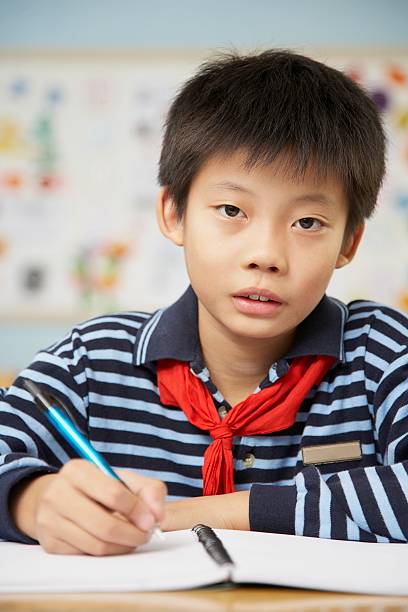 istock Chinese student in classroom at school 521464368