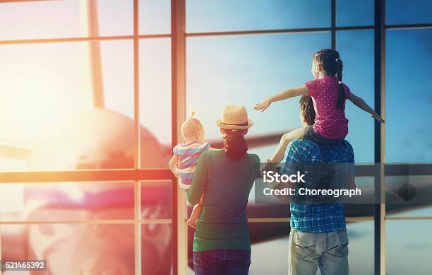Family With Children At The Airport Stock Photo - Download Image Now - Family, Airplane, Airport