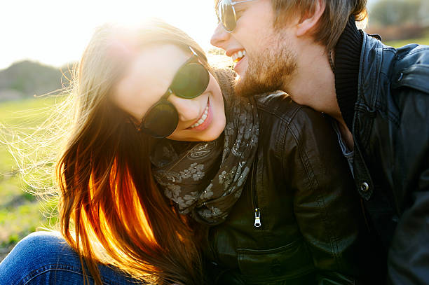 Happy and young couple in love going out and having fun