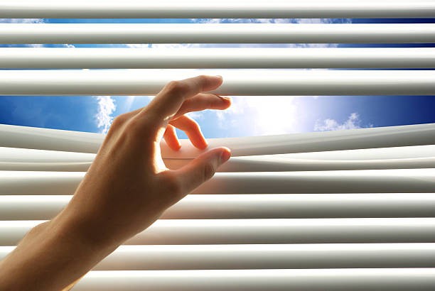 istock Hand open the jalousie 521467566