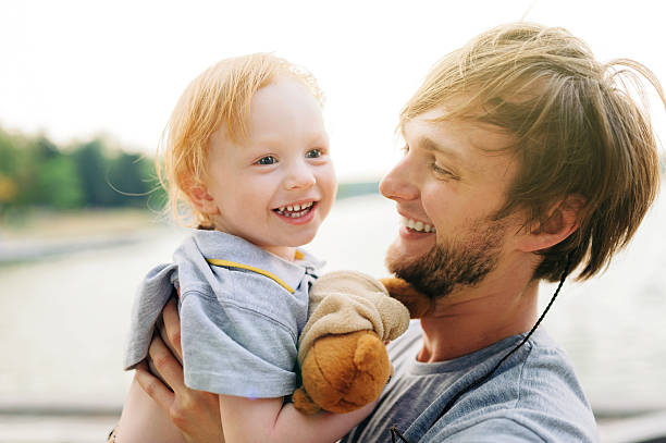 istock Young happy father and resting with his young son 521468238