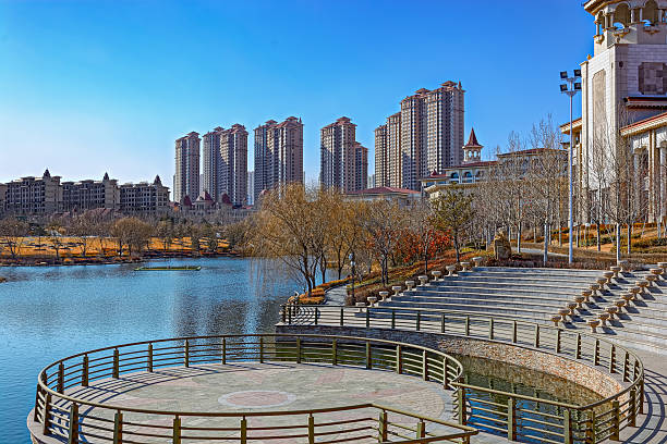 istock City park with a pond in China 521469746