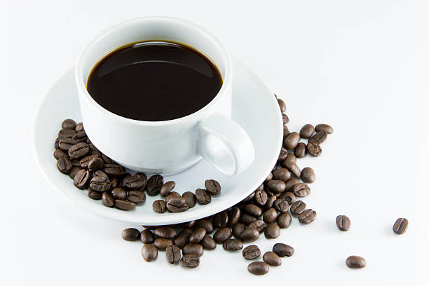 istock Coffee beans with leaves on white background 521469799