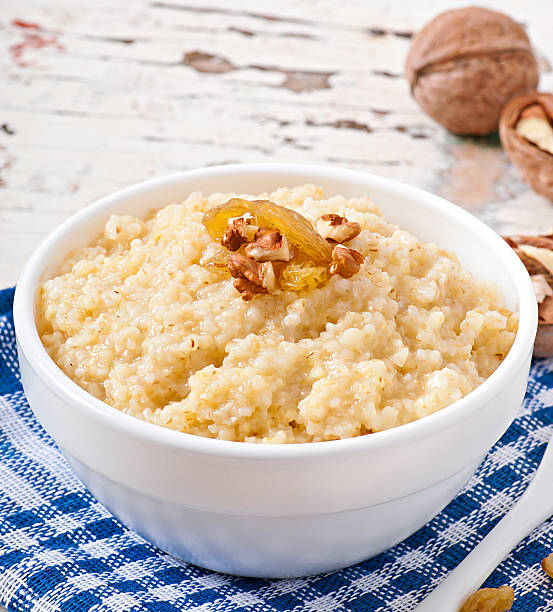 istock Porridge in a bowl with nuts and raisins 521469857