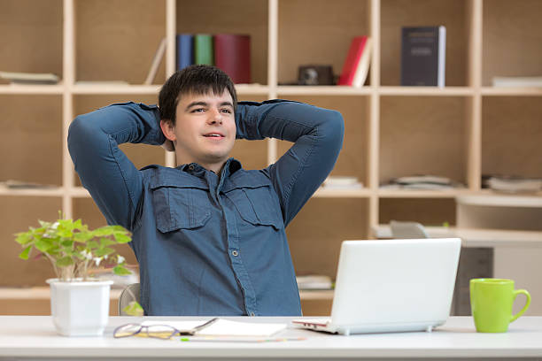 istock Happy young Man enjoying Job well done 521471726