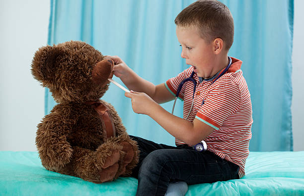 istock Preschooler and his teddy bear 521486955