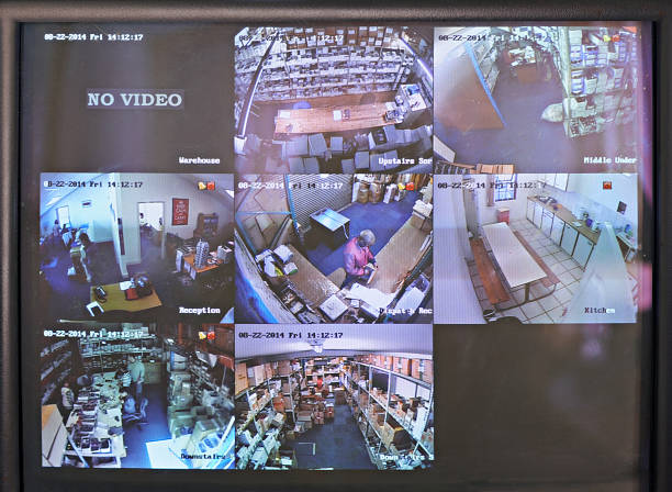 Keeping an eye for security Shot of a close circuit tv monitor watching a factory floor big brother orwellian concept photos stock pictures, royalty-free photos & images