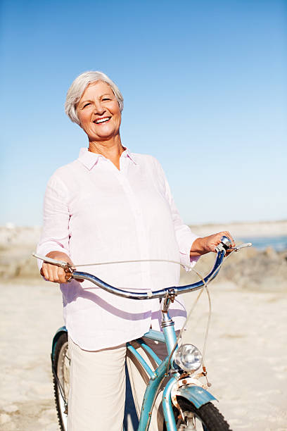 istock Happy Active Senior Woman Cycling Bicycle 521491001