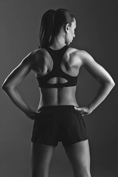 istock Sporty girl with muscles 521492618
