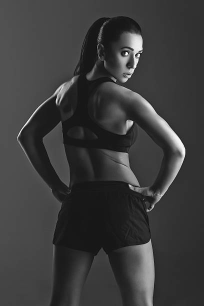 istock Sporty girl with muscles 521492830