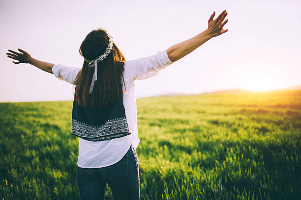 istock Girl says hello to the sun 521493816