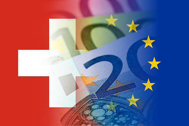 istock switzerland and eu flags with euro banknotes 521495040