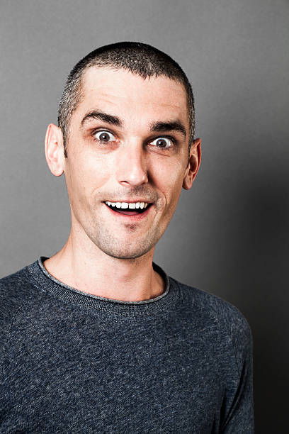 istock happy man with dark circles laughing to express his pleasure 521495870