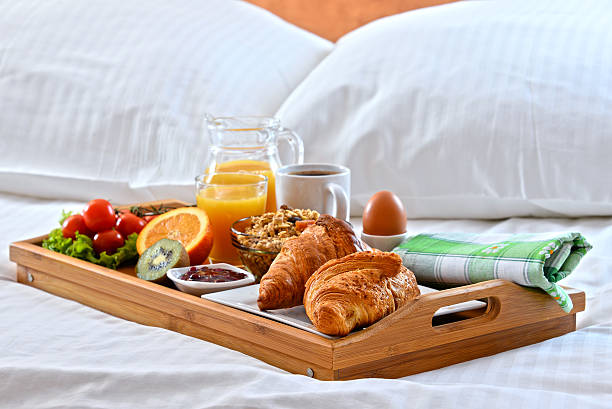 istock Breakfast tray in bed in hotel room 521496934