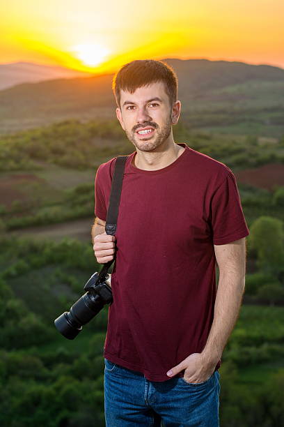 istock Young photographer enjoying sunset 521500008