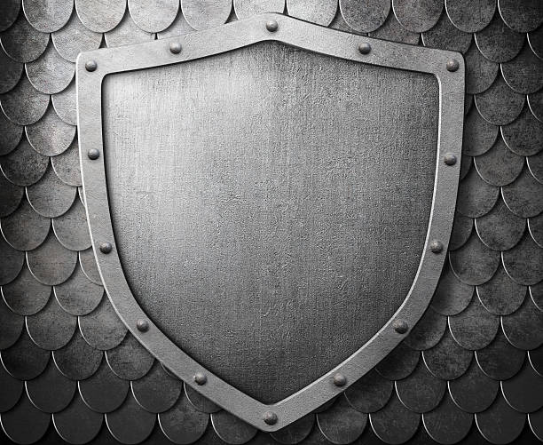 istock medieval coat of arms shield over metal scales background 521501896