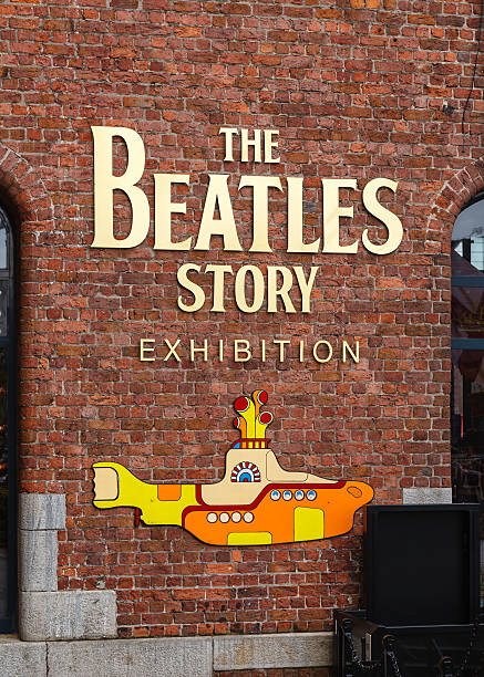 The Beatles Story Liverpool, England - May 25, 2015:  The entrance to the The Beatles Story.  The exhibition at The Albert Dock in Liverpool is dedicated to the 1960s rock band The Beatles. beatles stock pictures, royalty-free photos & images