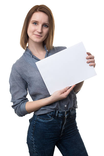 istock girl holding a blank placard. 521507404
