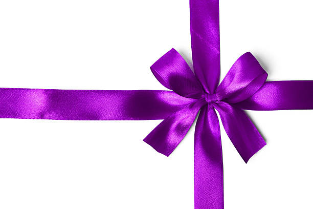 istock Shiny purple satin ribbon on white background 521513623