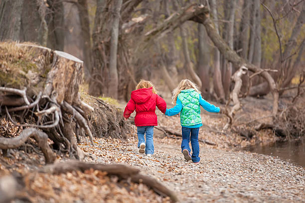 istock Girls Walking Along Riverbank 521513925