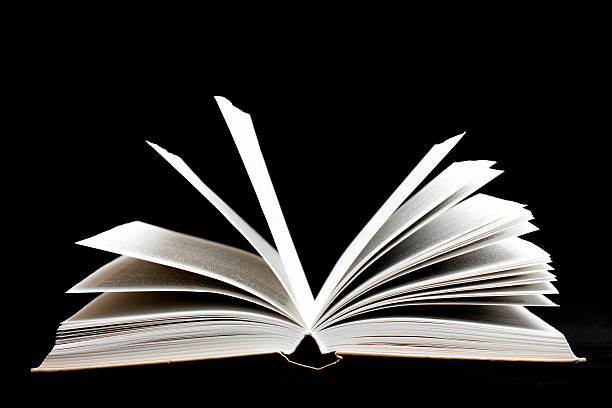 istock Old book on black color background 521514753