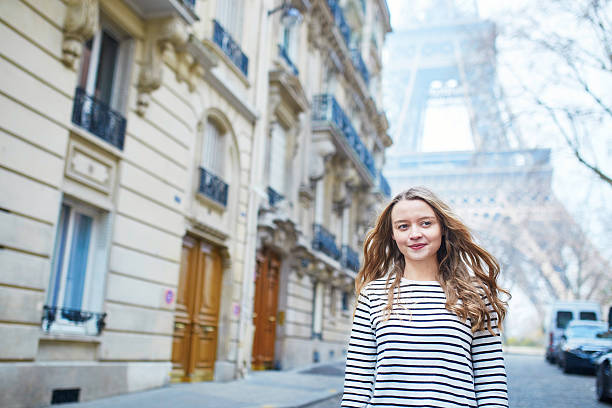 istock Girl outdoors near the Eiffel tower, in Paris 521526988