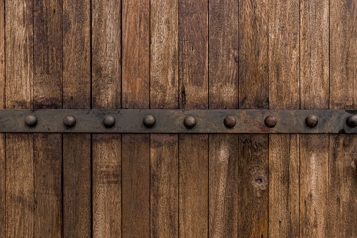 Metal on old wooden background for design