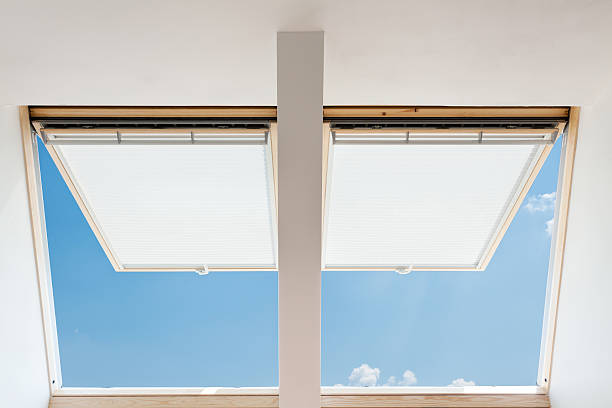 istock Modern open skylights (mansard windows) in an attic room 521528574
