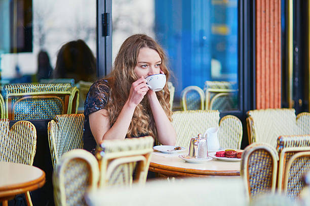 istock Beautiful Parisian woman in cafe 521528984