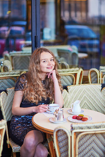 istock Beautiful Parisian woman in cafe 521529420