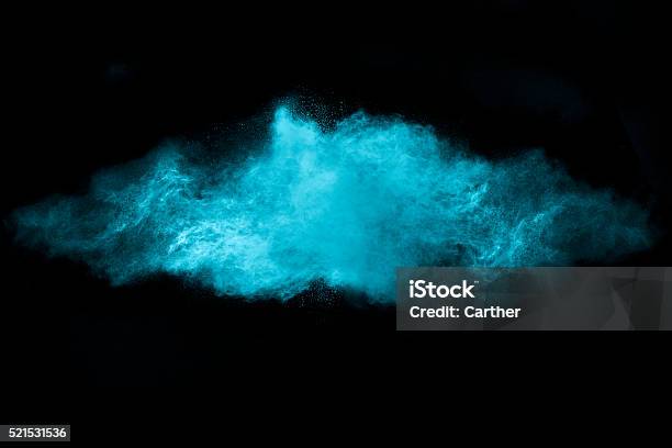 Blue Dust Particle Explosion Isolated On Black Stock Photo - Download Image Now - Powder Snow, Blue, Dust