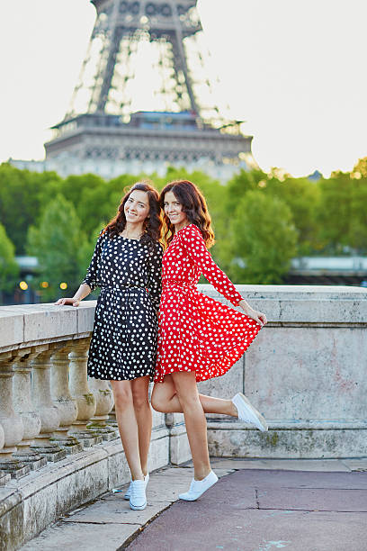 istock Beautiful twin sisters in front of the Eiffel tower 521534846