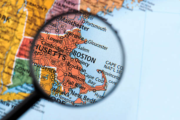 Map of Boston Map of Boston. Detail from the World Atlas. Selective Focus. massachusetts map stock pictures, royalty-free photos & images