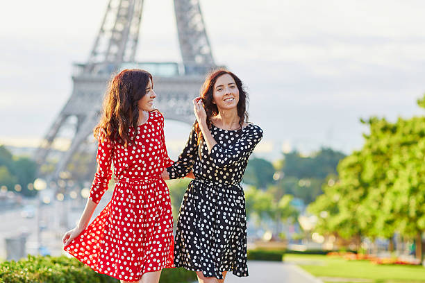 istock Beautiful twin sisters in front of the Eiffel tower 521535284