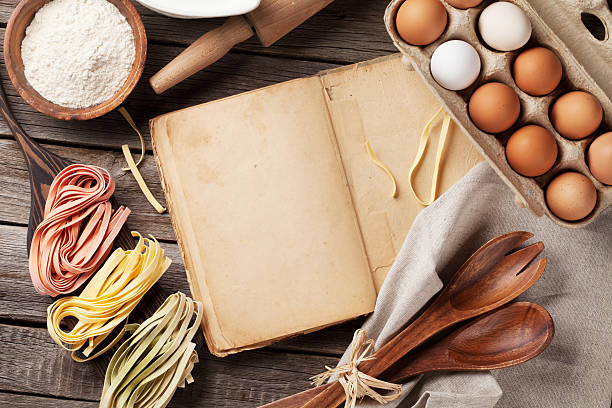 istock Vintage recipe book, utensils and ingredients 521536150