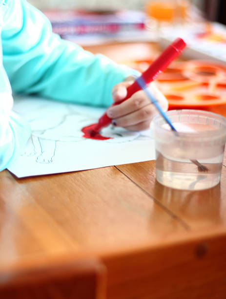 istock Little Girl Painting 521539478