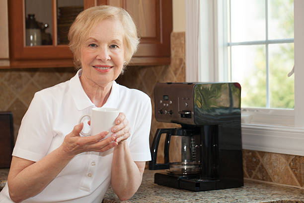 istock senior woman enjoys her freshly made coffee 521541654