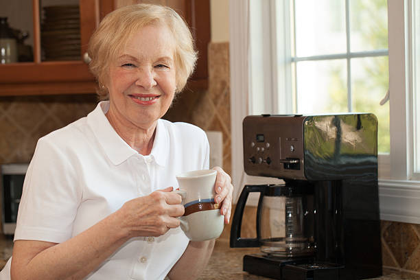 istock Senior woman enjoys her freshly made coffee 521541682