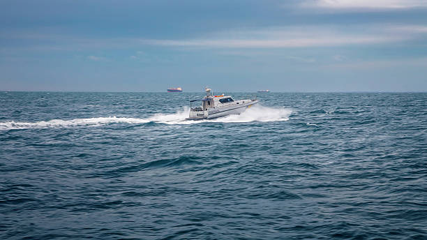 istock boat floating on waves of the sea 521543756
