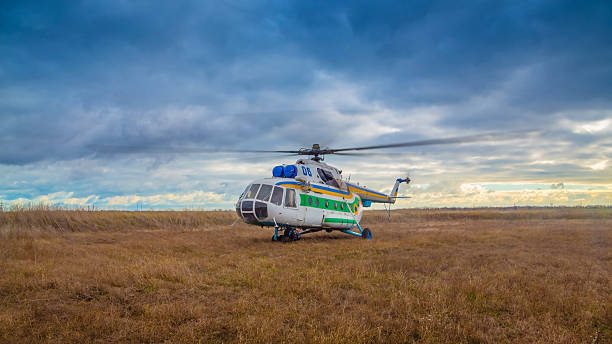 istock Helicopter taking off in a field 521543806