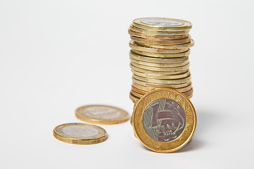 Stack of gold coins With Up Arrow On White Background