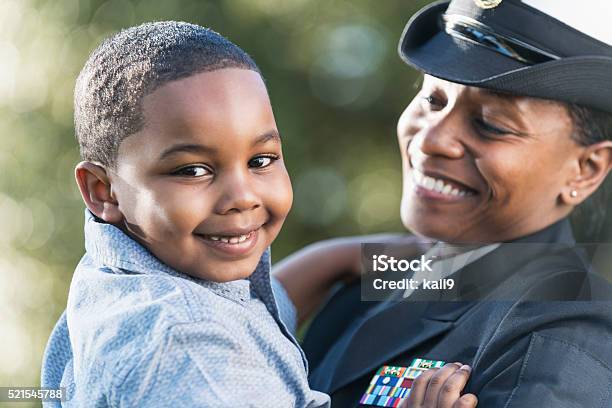 Mother In Navy Officer Uniform Holding Son Stock Photo - Download Image Now - Military, Navy, Family