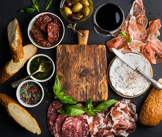 istock Wine snack set with empty wooden board in center. Glass 521549138