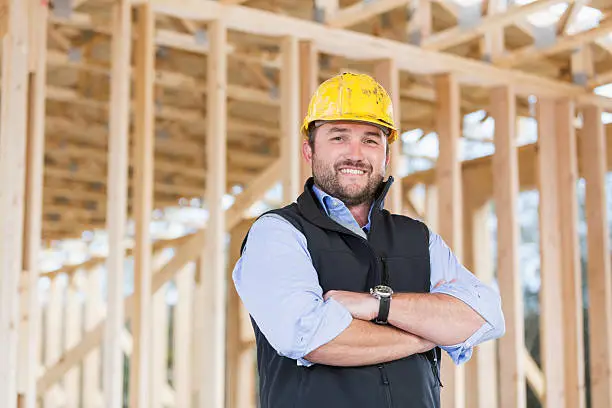 Photo of Worker wearing hardhat at construction site