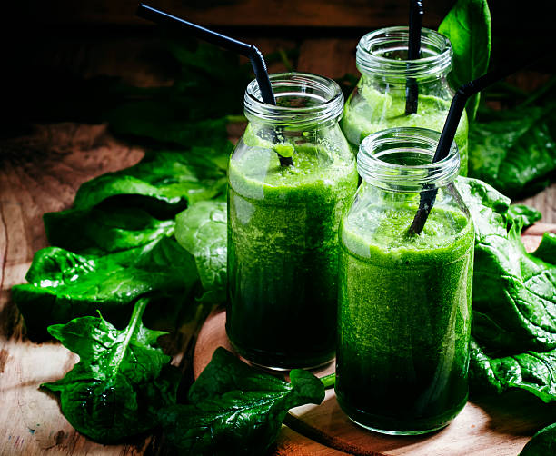 istock Green detox drink, a glass bottle 521549712