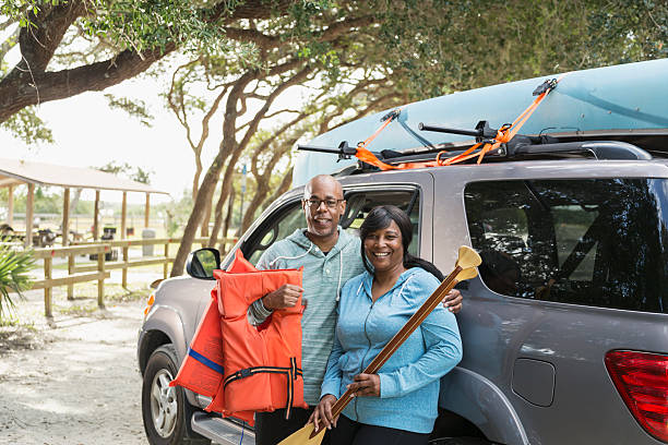 Mature couple preparing to go canoeing