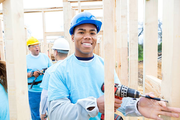 istock African American volunteer uses drill at work site 521550836